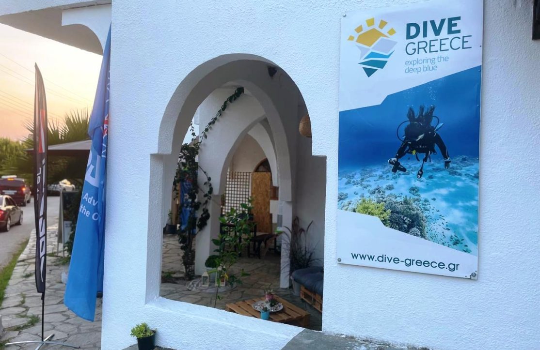 Entrance to Dive Greece PADI Dive Center in Halkidiki, Greece, with official signage and flags. Your starting point for scuba adventures.